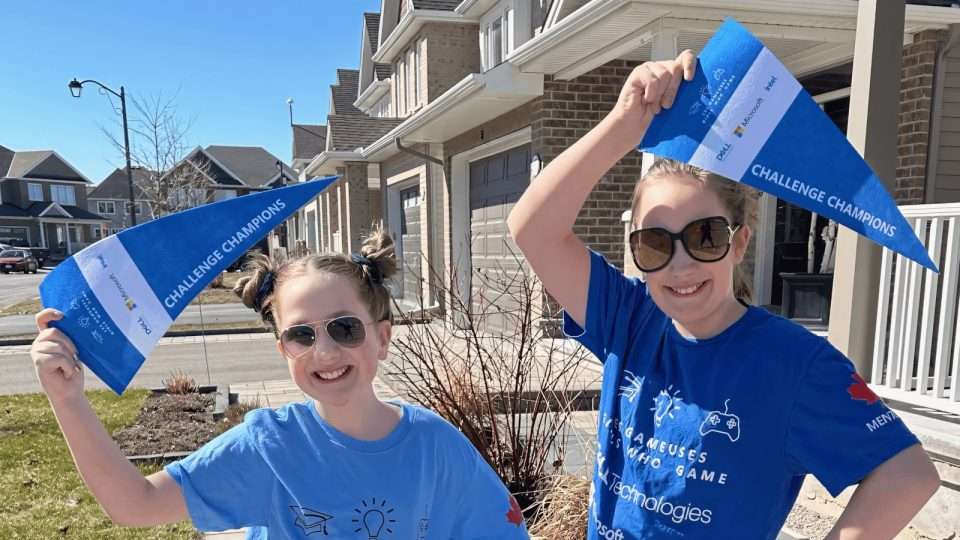 OCSB students holding Challenge Champions flags