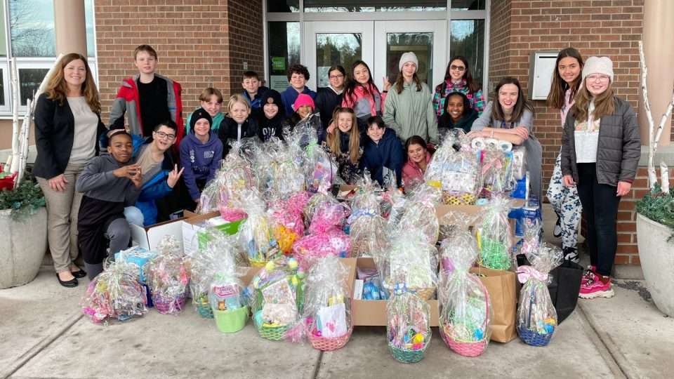 children handing out donations in memory of Shelley