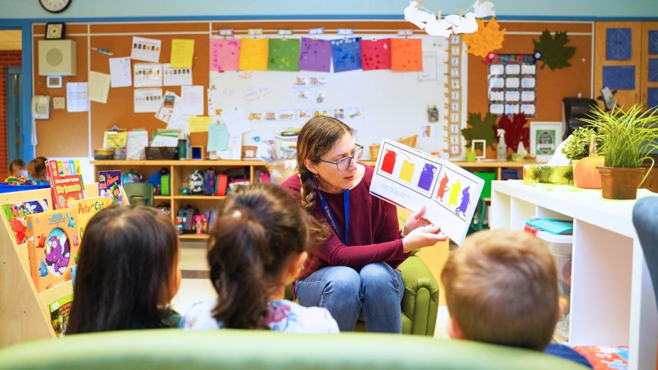 Kindergarten teacher with students