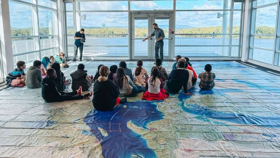 OCSB students waling on a giant map