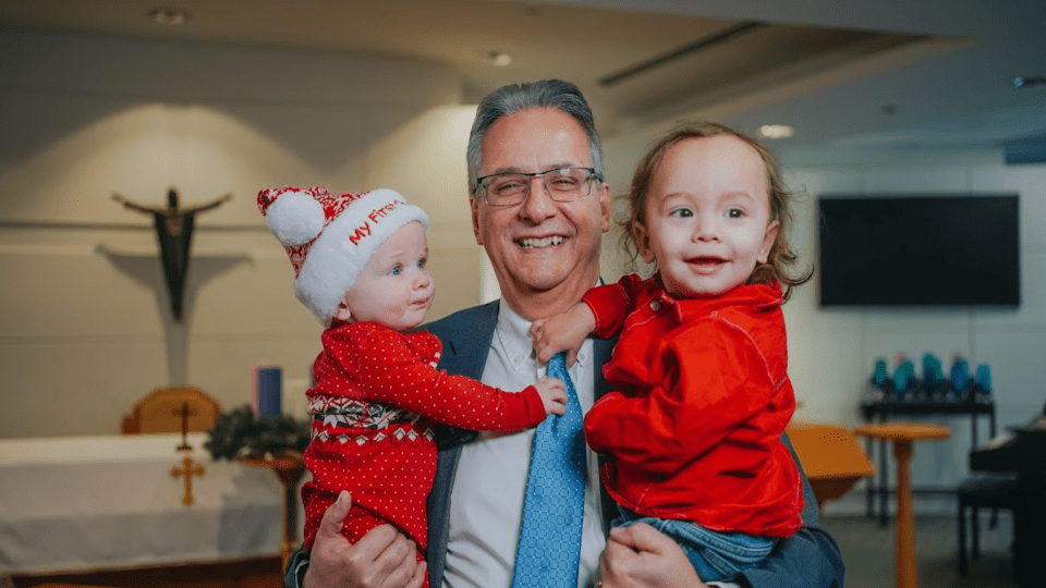 Tom D'amico with children at OCSB Christmas event