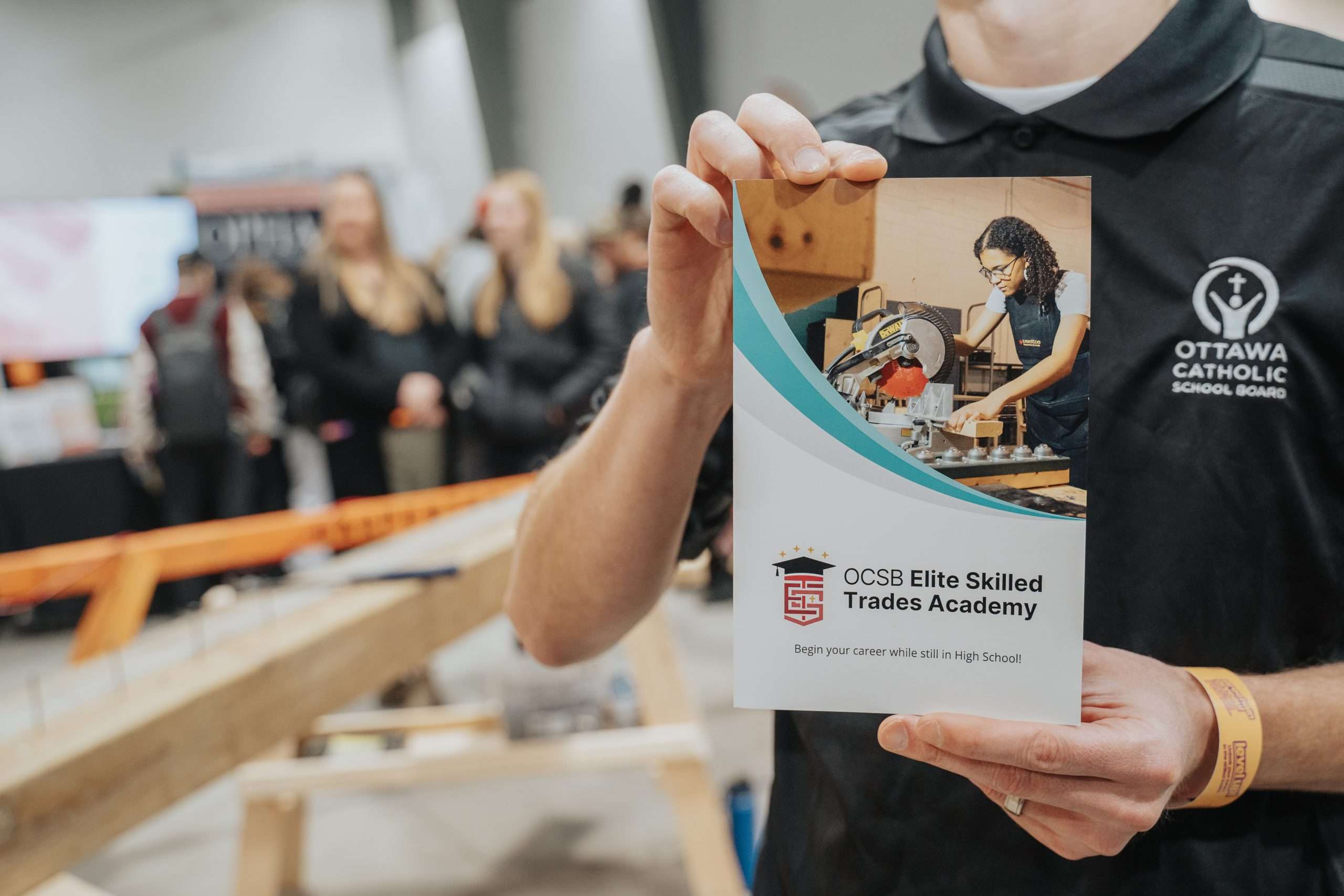 ESTA staff member holding a brochure
