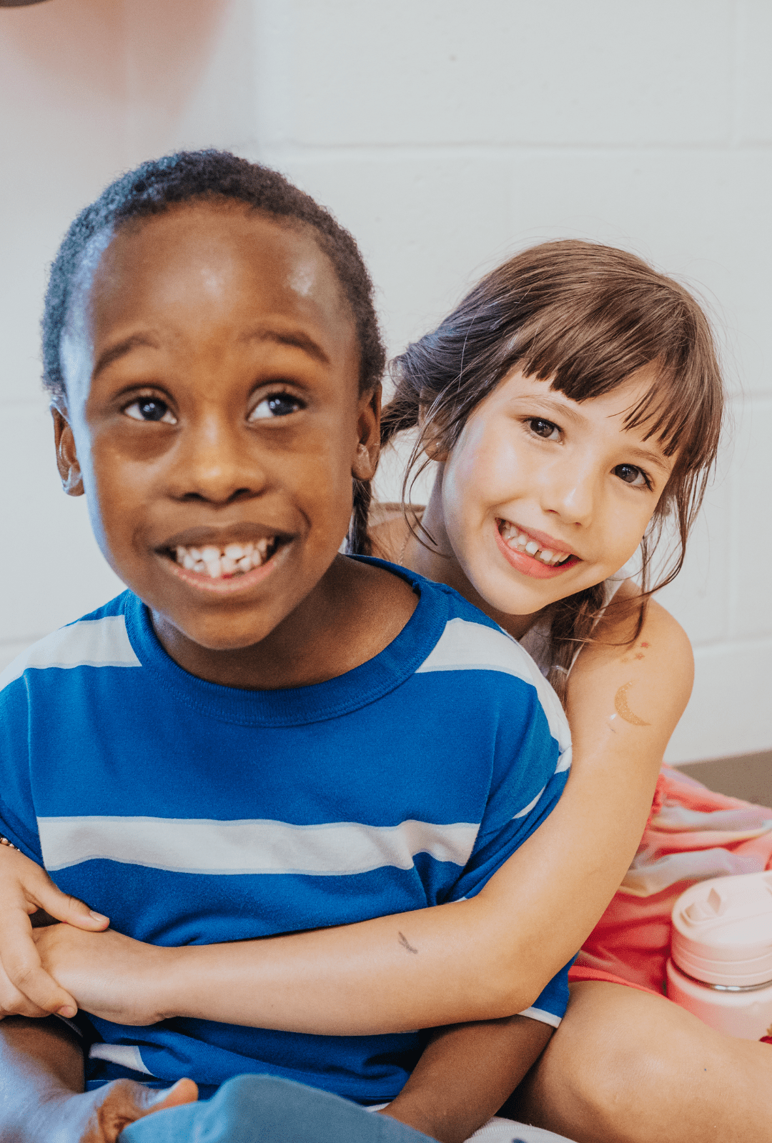 A child hugging another child at an OCSB school