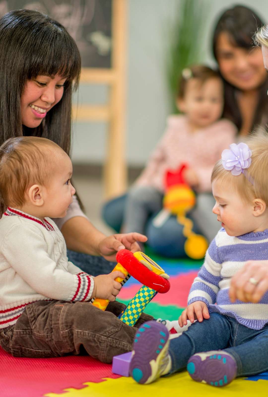mothers with children playing together