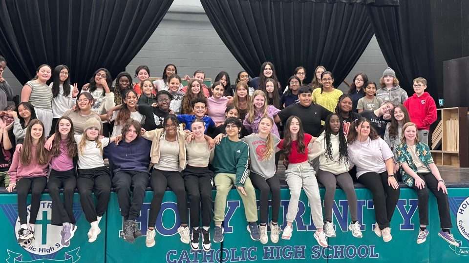 Students on stage at Holy Trinity High School
