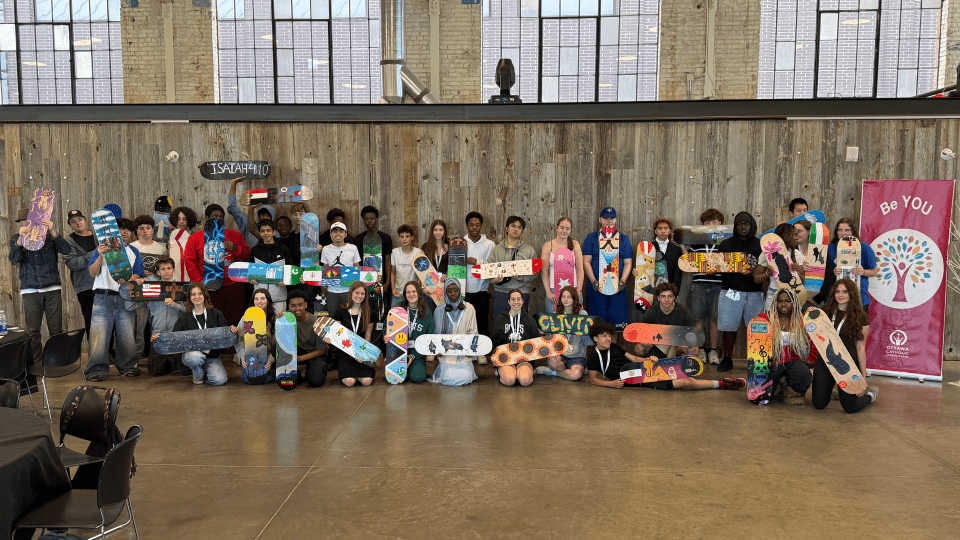 Participants of OCSB Be YOU Project posing with their artwork