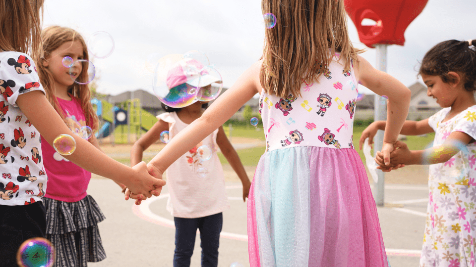 OCSB Kindergarten students playing outdoors in the summer