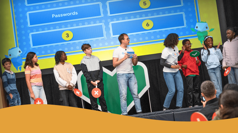 Students and facilitators interact on stage during the Internet Awesome conference