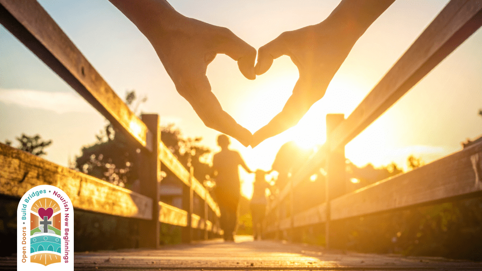 Children walking on a bridge and a heart shaped hand with OCSB Spiritual Theme logo