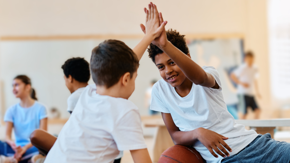 2 children giving a high five