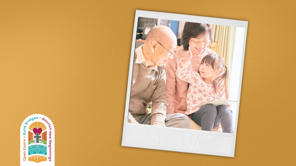 a child reading with her grandparents