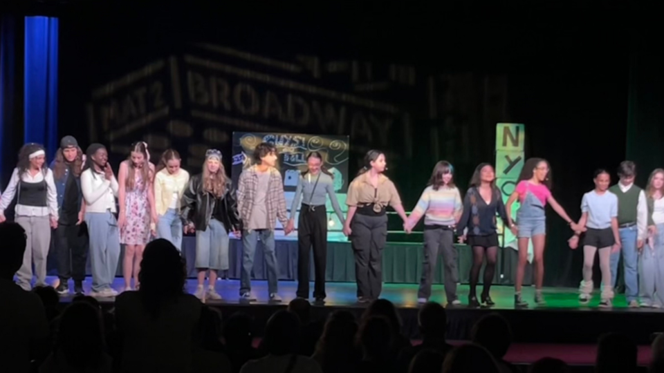 Holy Trinity students on the stage